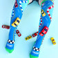 Bright racing car character socks featuring colorful sporty details and fun playful patterns.