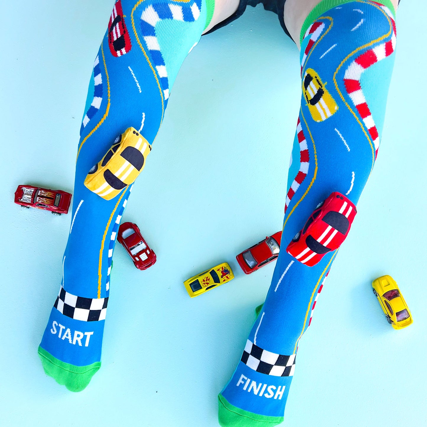Bright racing car character socks featuring colorful sporty details and fun playful patterns.