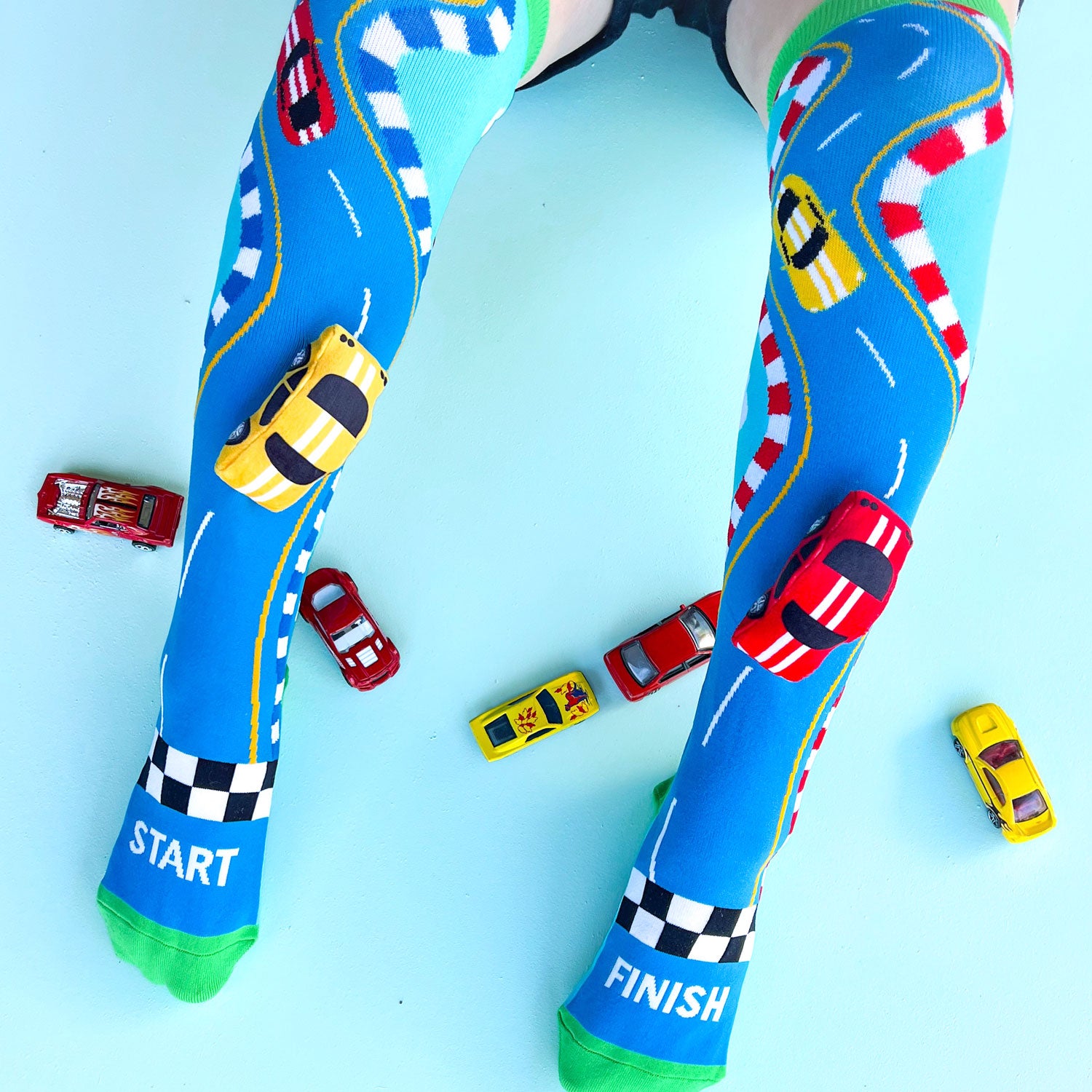 Bright racing car character socks featuring colorful sporty details and fun playful patterns.