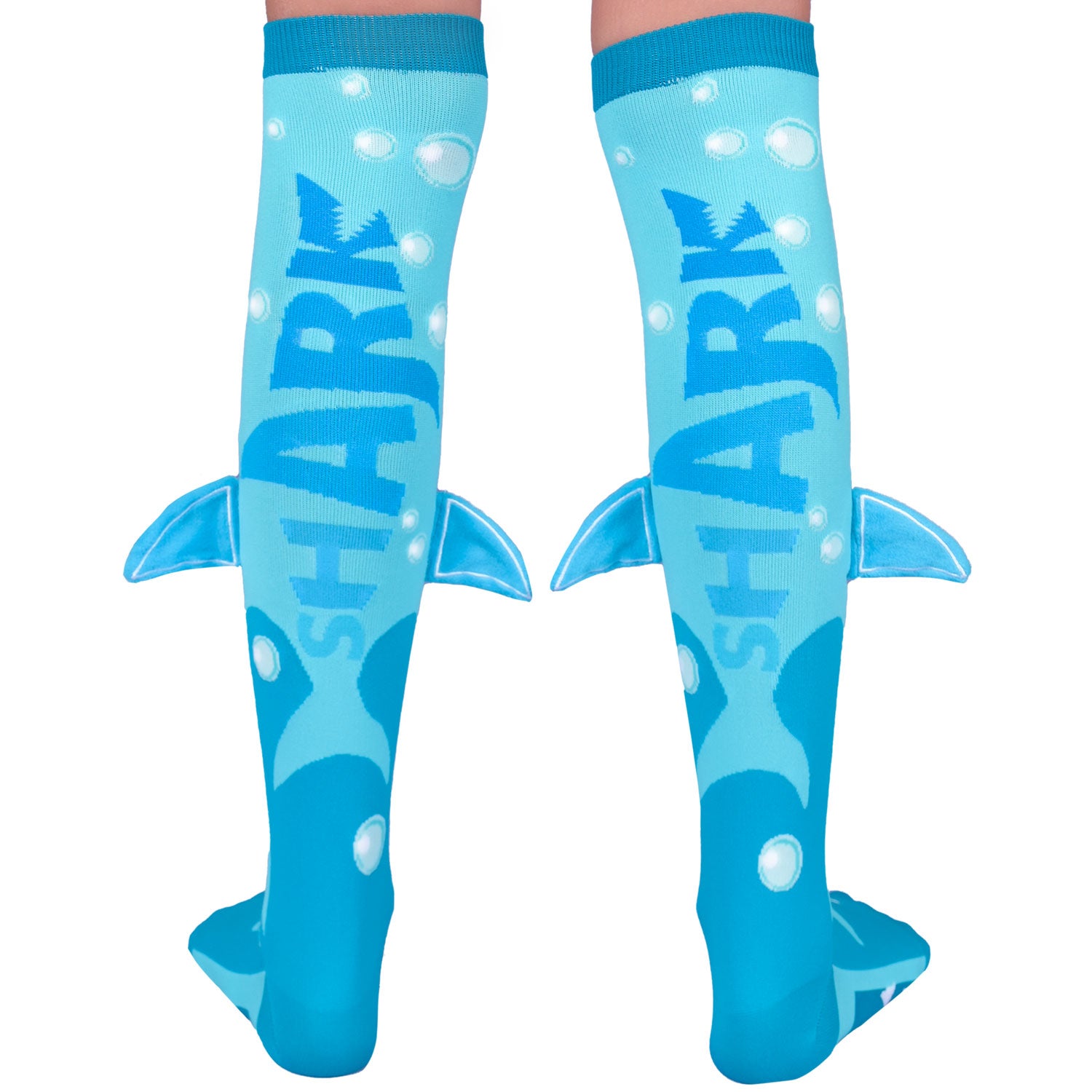 Colorful shark socks for kids and adults featuring fun ocean-themed patterns and plush fins.