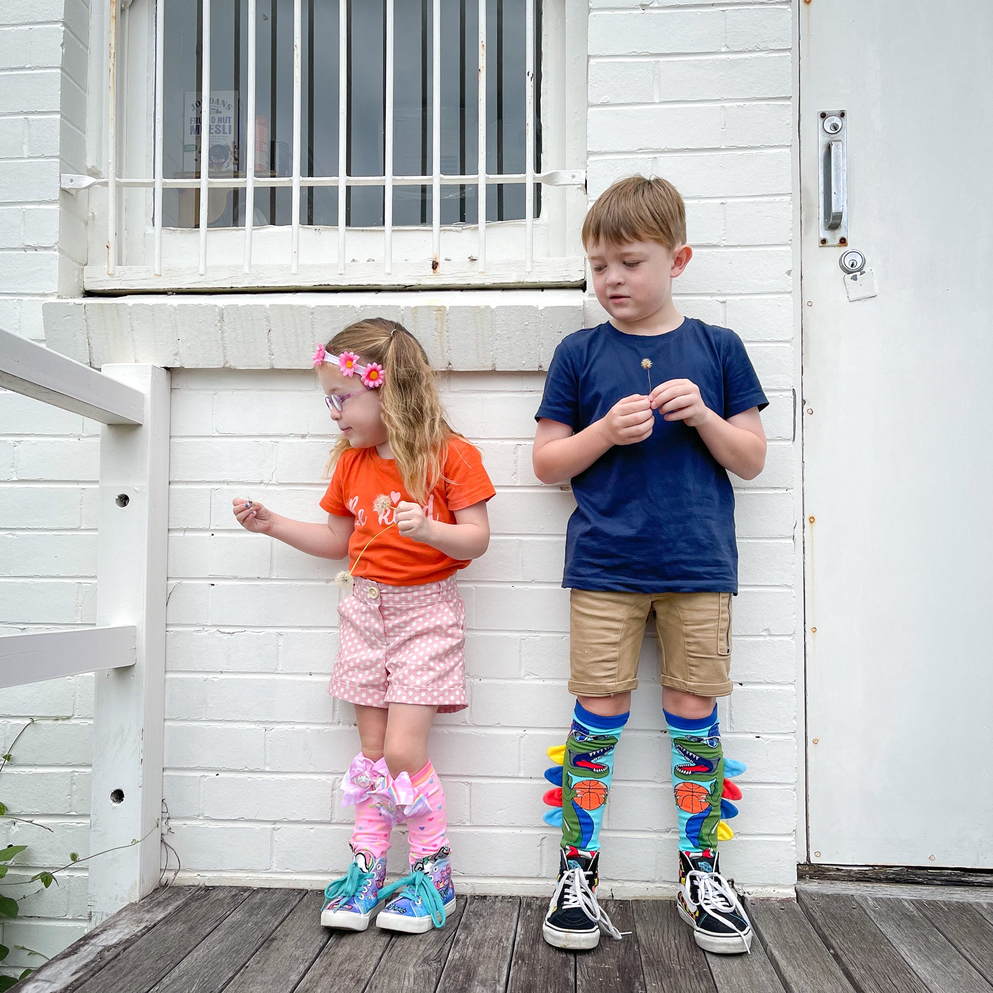 Dino character socks with vibrant colors and soft plush spike accents for adventurous style.