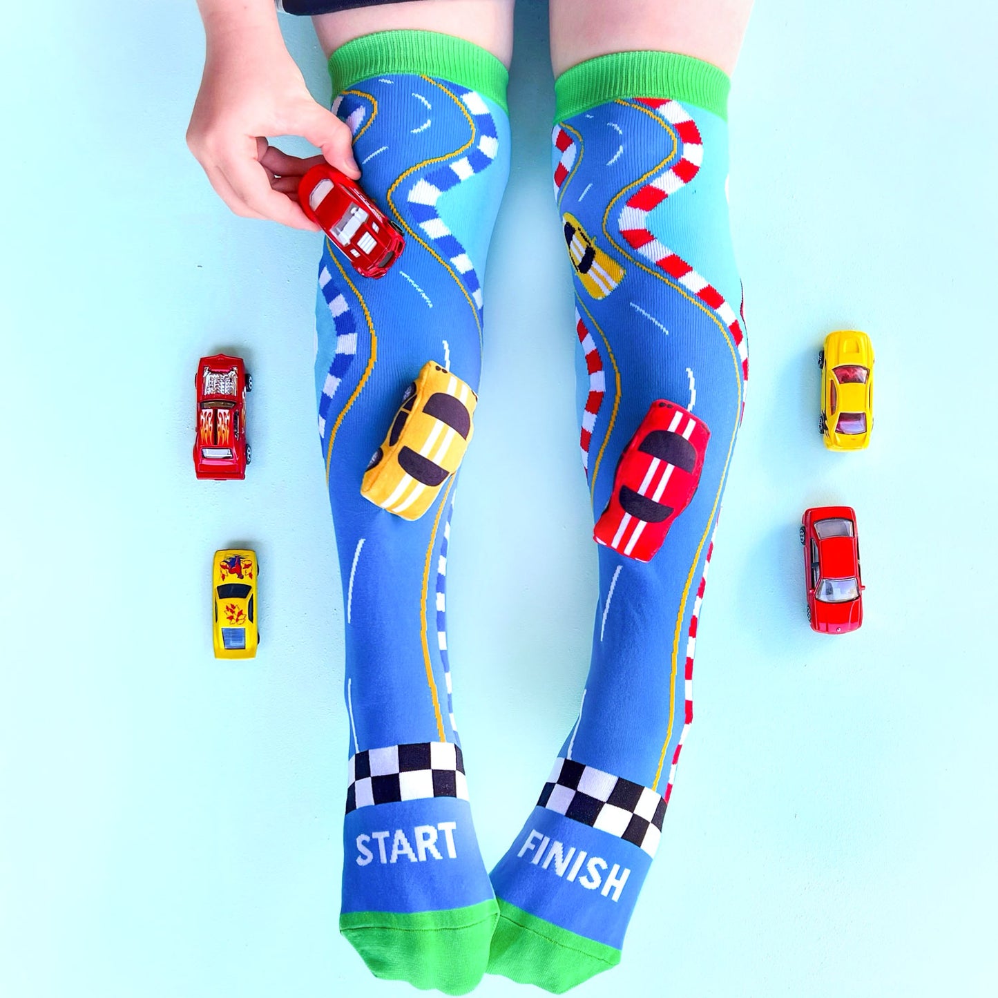 Fun racing car knee high socks with bold colors and energetic race-themed graphics.