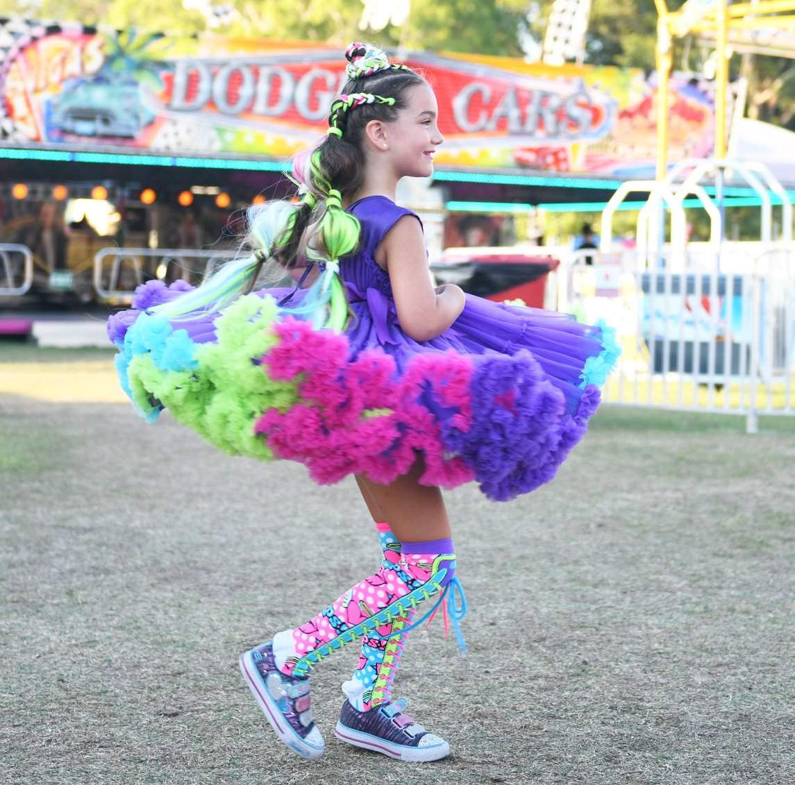 Limited edition MADMIA Wonderland Dress featuring bright rainbow colors, soft tulle layers, and playful frills for special occasions.