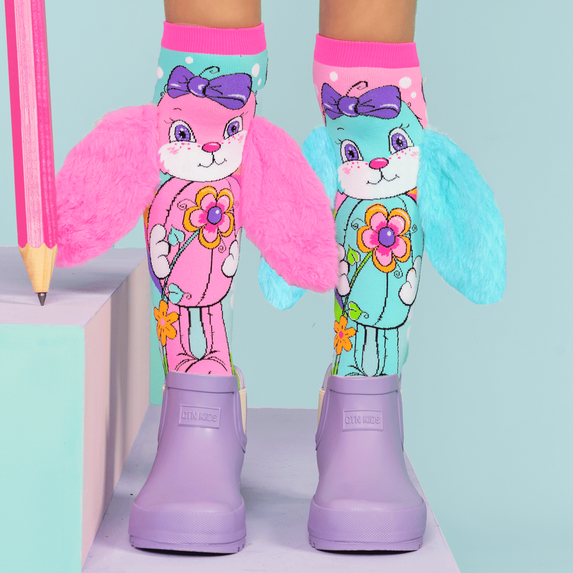Pastel bunny novelty socks with colorful design and playful bunny ear details.