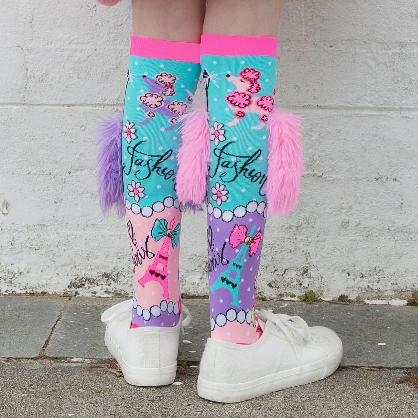 Travel theme novelty socks with Paris-inspired patterns and playful colorful details.
