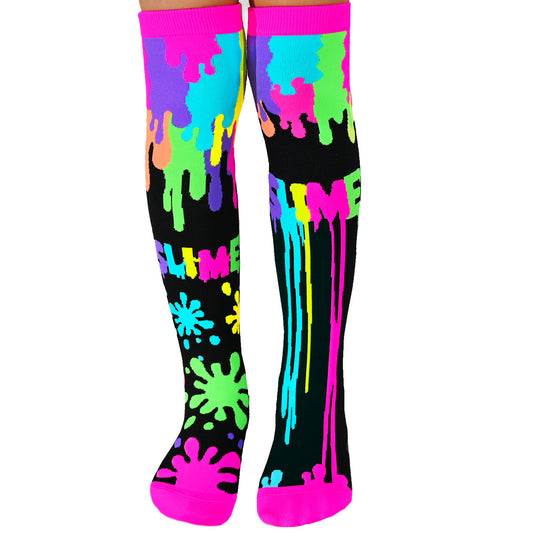 Colorful MADMIA slime socks featuring messy neon drip patterns that glow under UV light and add playful fun to every step.