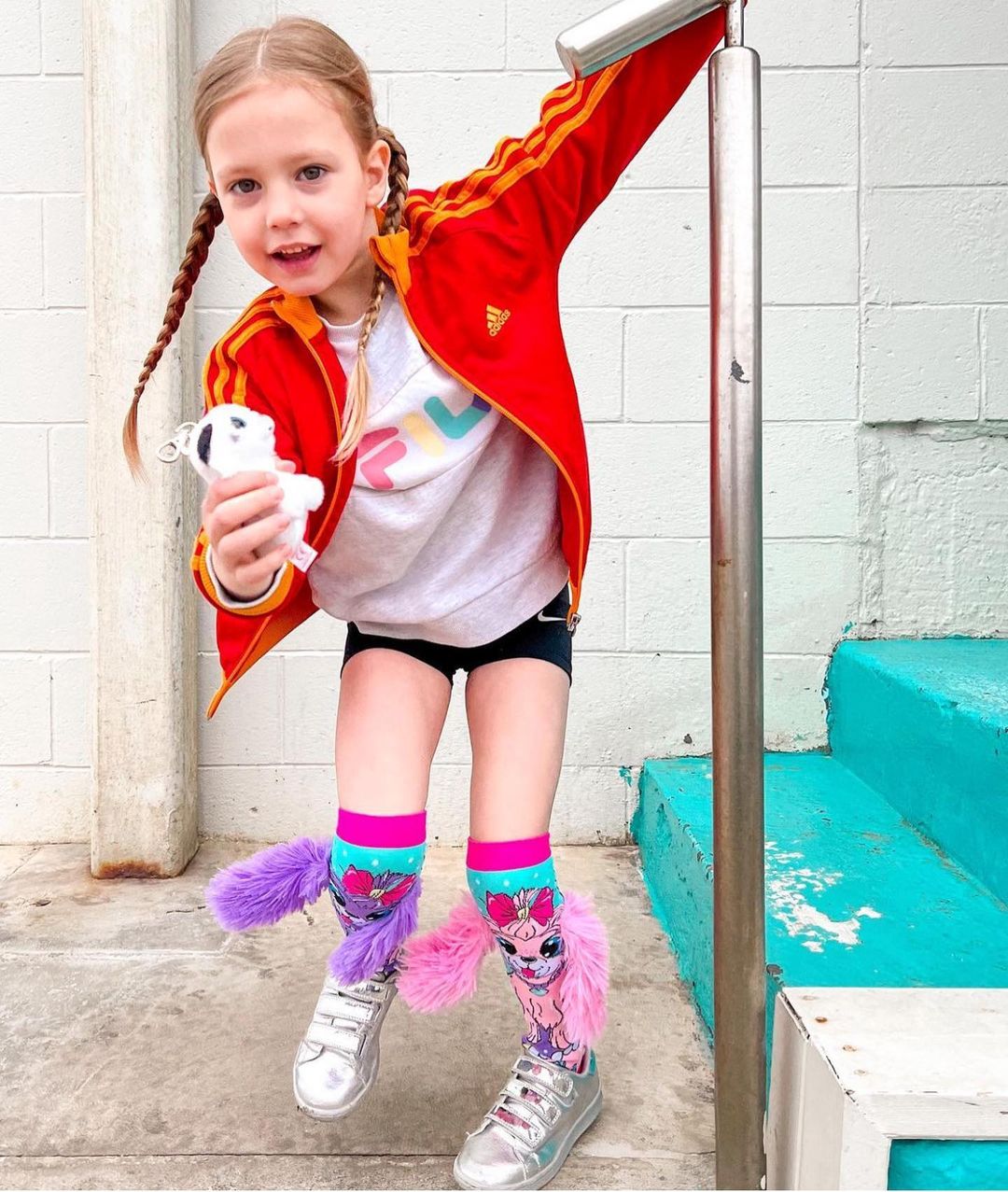 Whimsical Coco in Paris socks with bright cheerful colors and playful travel-inspired design.